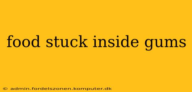food stuck inside gums